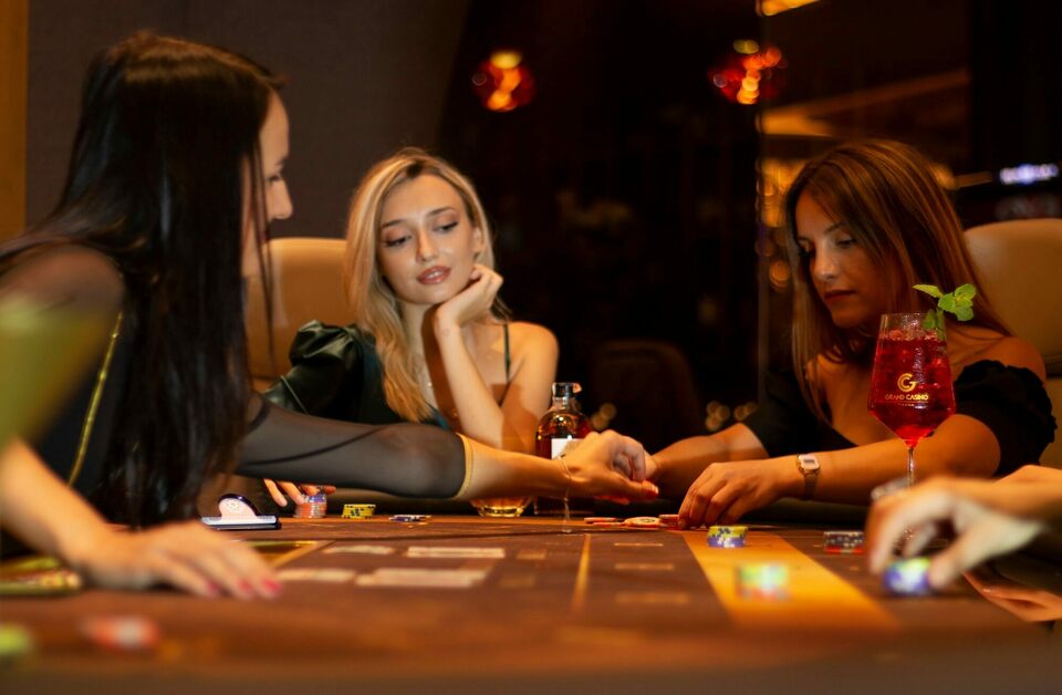 females placing bets at casino table